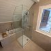 Chantier de paroi et porte de douche sur mesure à Collex-Bossy par RG Vitrerie
